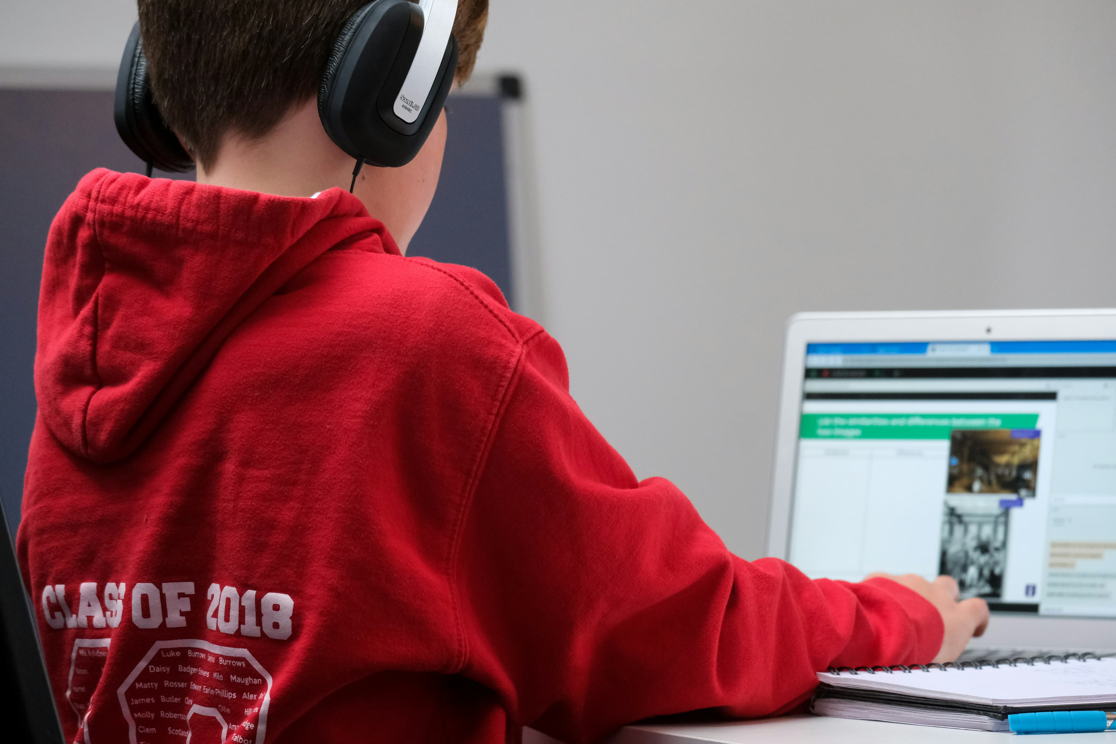 A young student on their laptop studying
