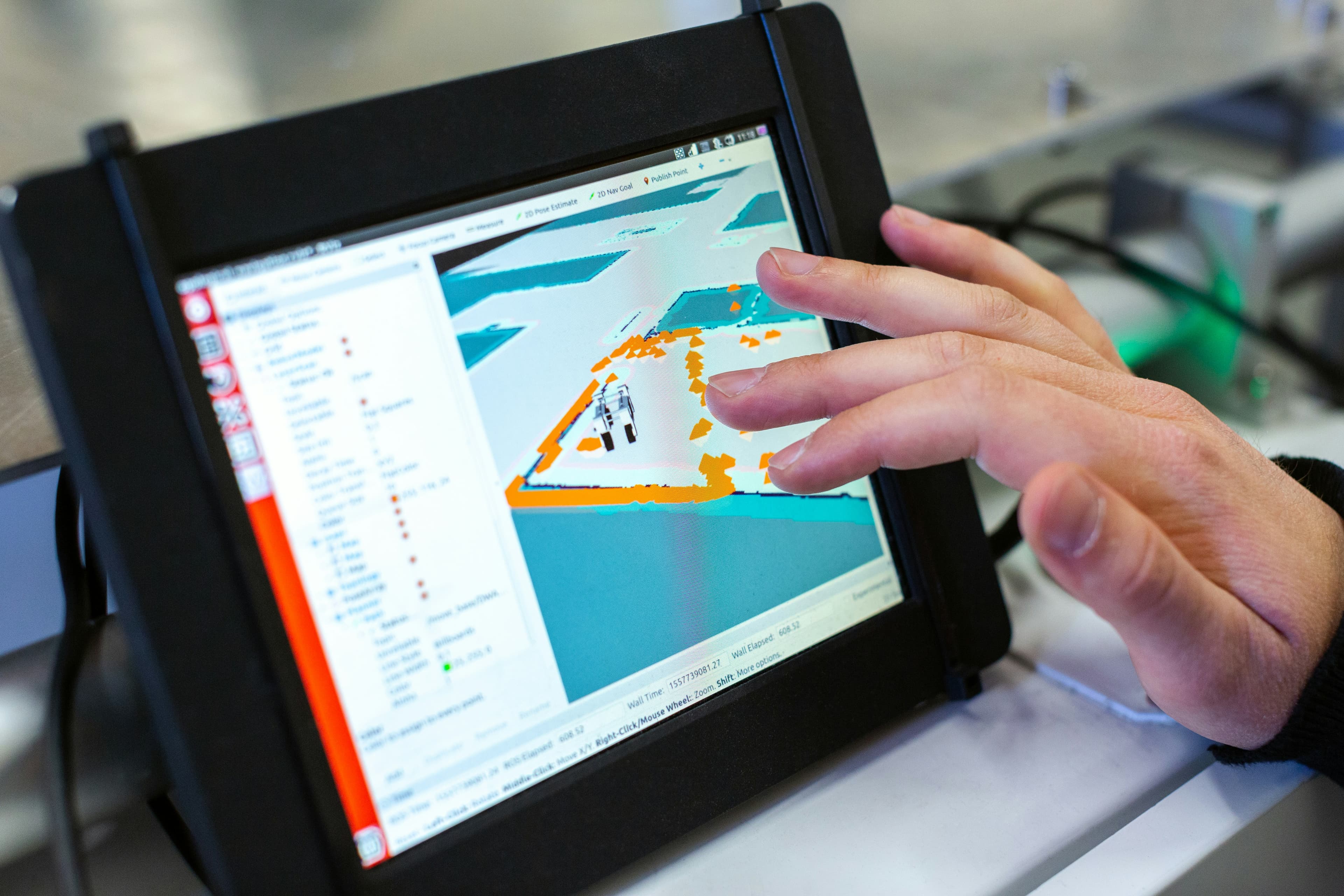 A close-up view of a person operating a tablet