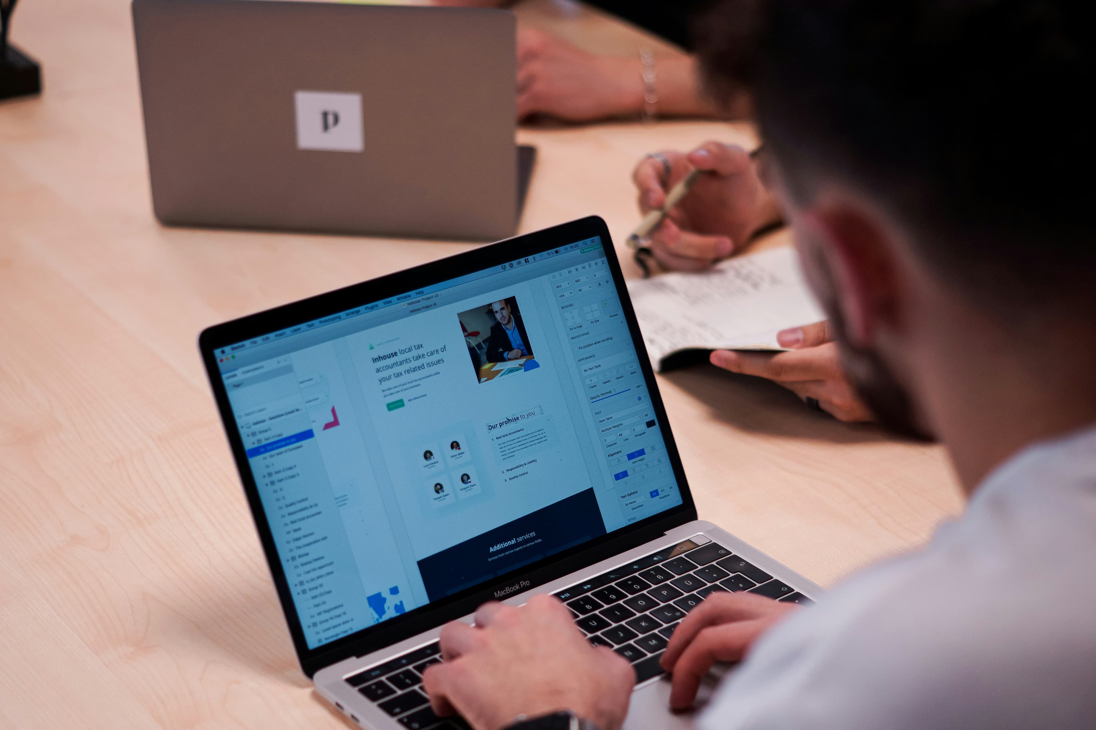 UX designer sitting at laptop